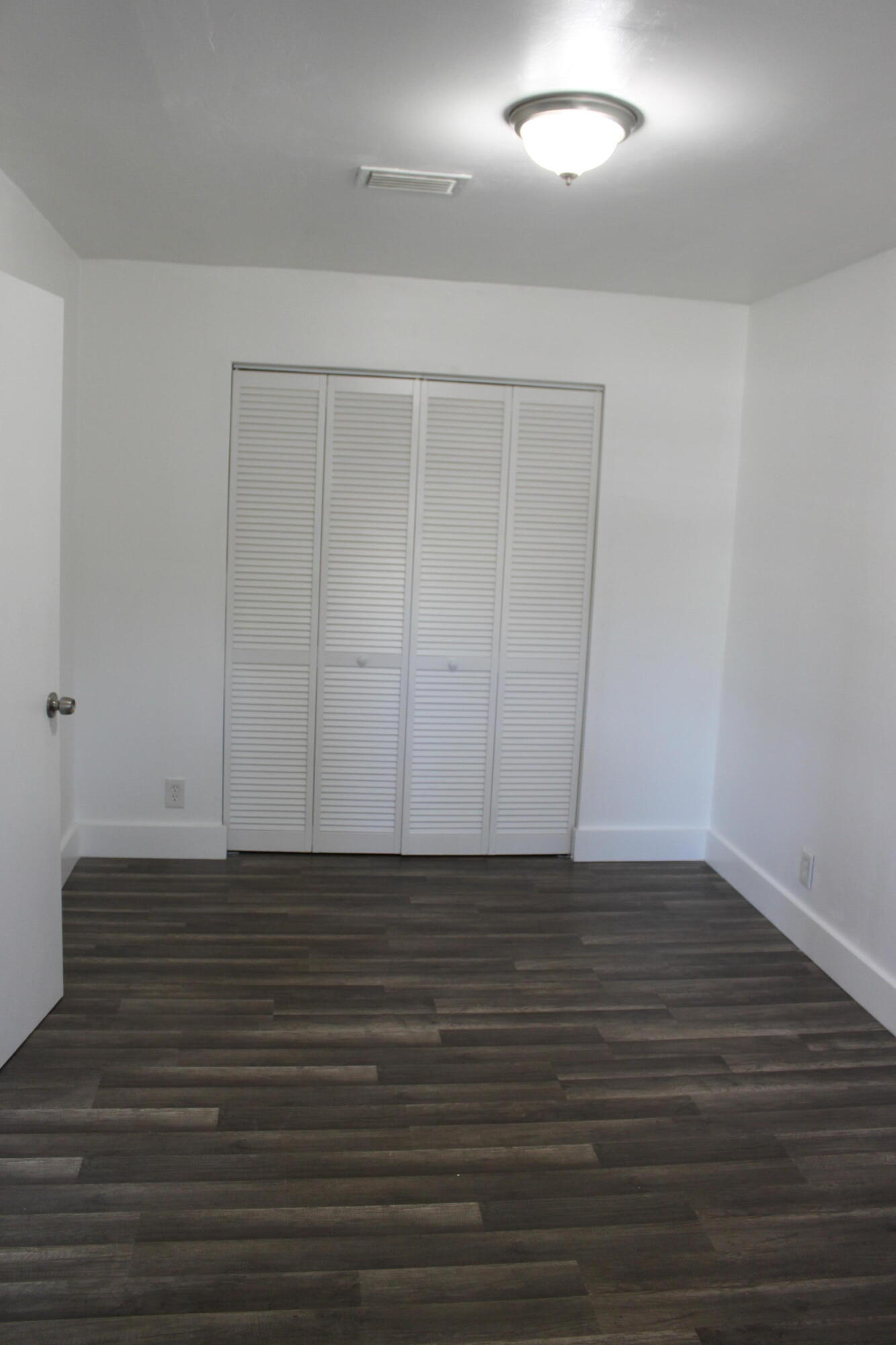 3240 Southwest 4th Street Deerfield Beach, FL 33442 - Photo 14 of 28 a view of an empty room with wooden floor