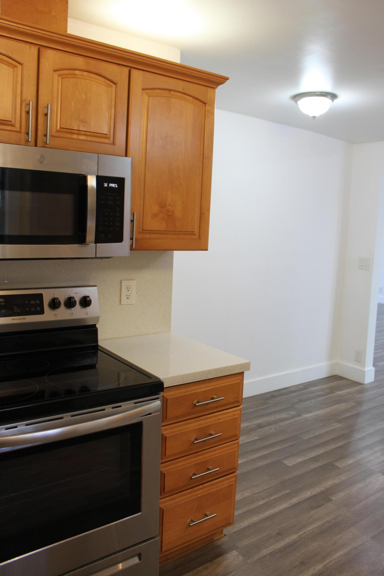 3240 Southwest 4th Street Deerfield Beach, FL 33442 - Photo 18 of 28 a stove top oven sitting inside of a kitchen