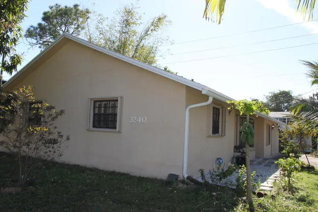 a backyard of a house with lots of green space