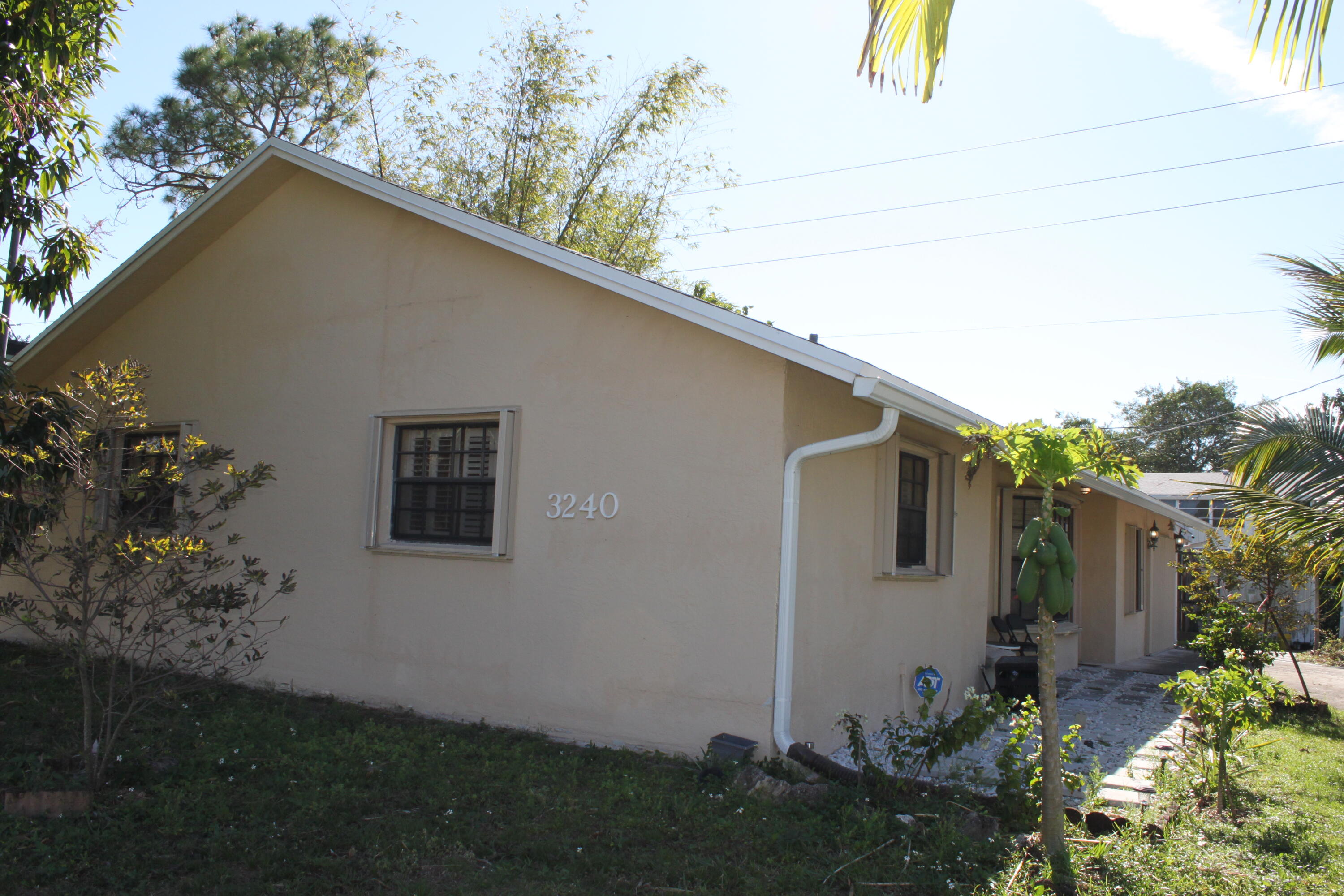 3240 Southwest 4th Street Deerfield Beach, FL 33442 - Photo 25 of 28 a backyard of a house with lots of green space