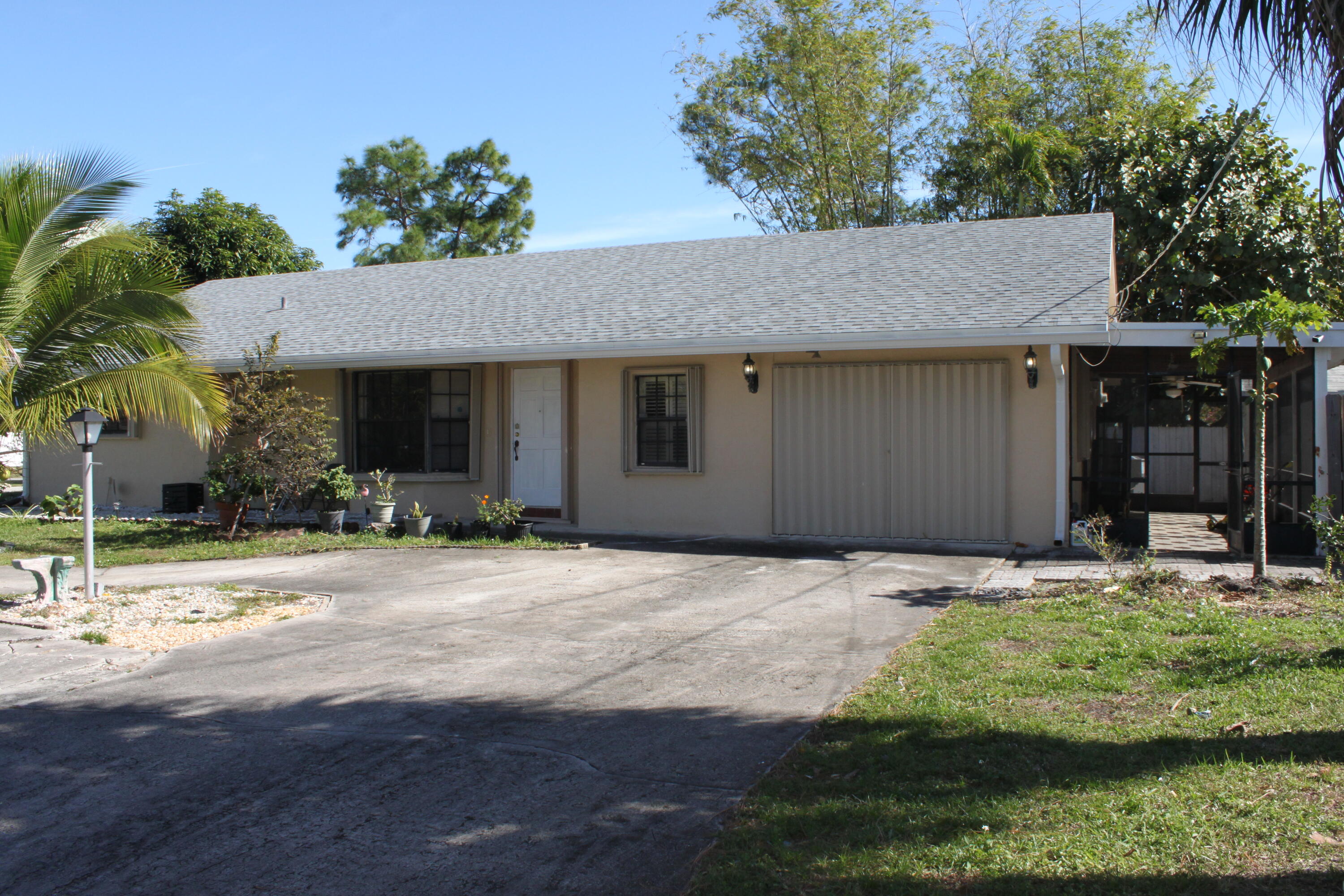 3240 Southwest 4th Street Deerfield Beach, FL 33442 - Photo 26 of 28 a house with yard in front of it