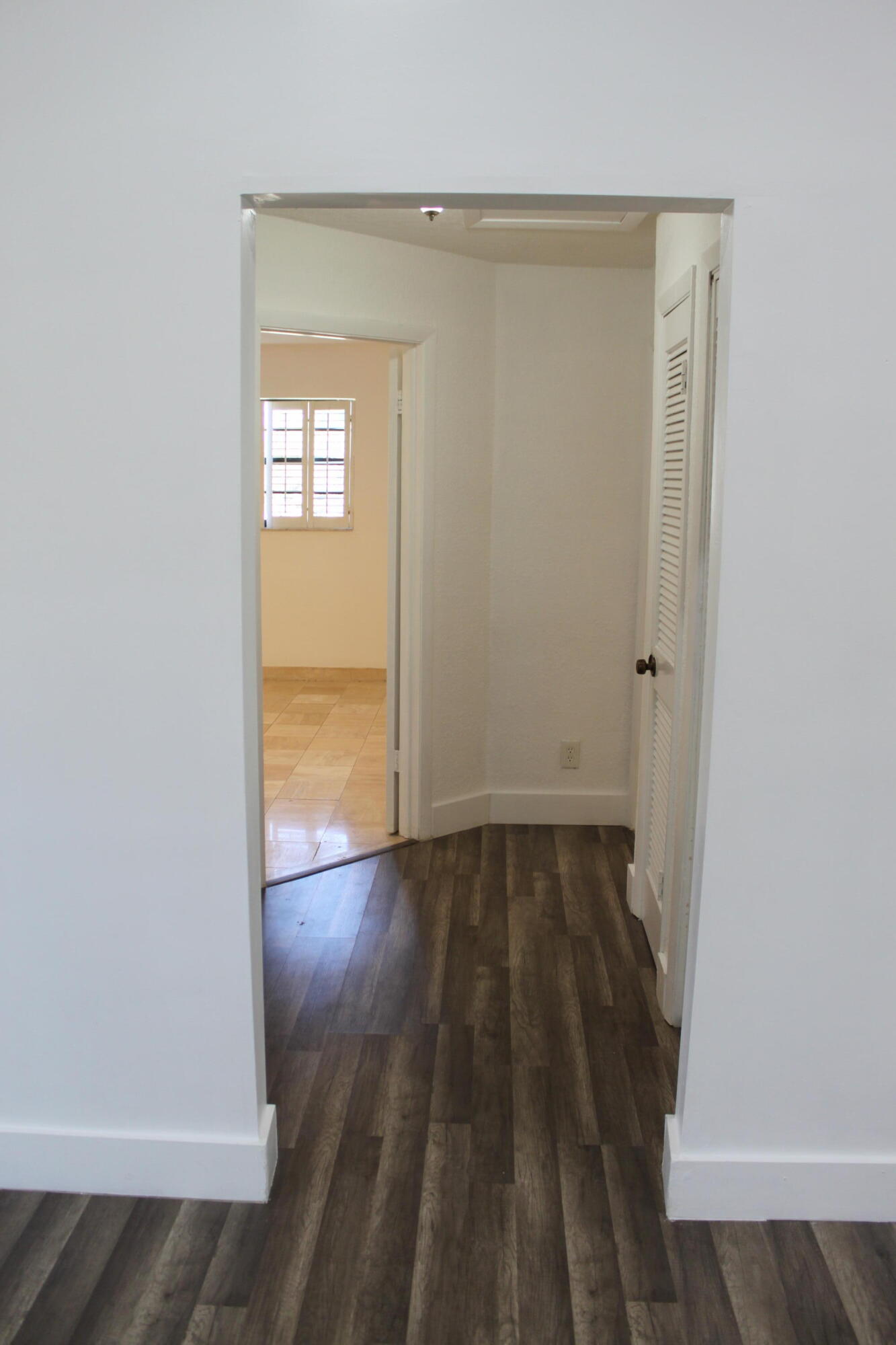 3240 Southwest 4th Street Deerfield Beach, FL 33442 - Photo 4 of 28 an empty room with wooden floor and windows