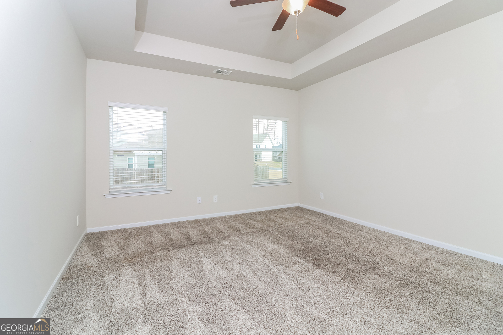 13 Applewood Drive Northeast Rome, GA 30165 - Photo 11 of 22 an empty room with windows and fan