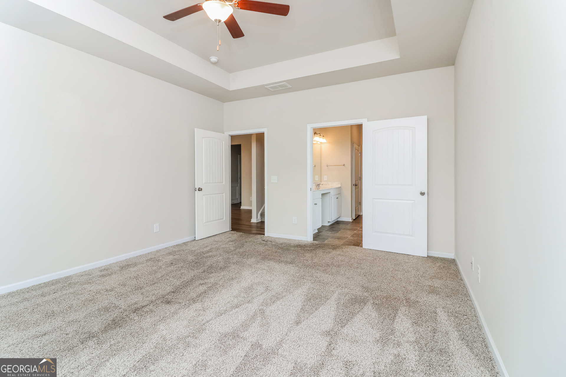 13 Applewood Drive Northeast Rome, GA 30165 - Photo 12 of 22 an empty room with chandelier fan and windows