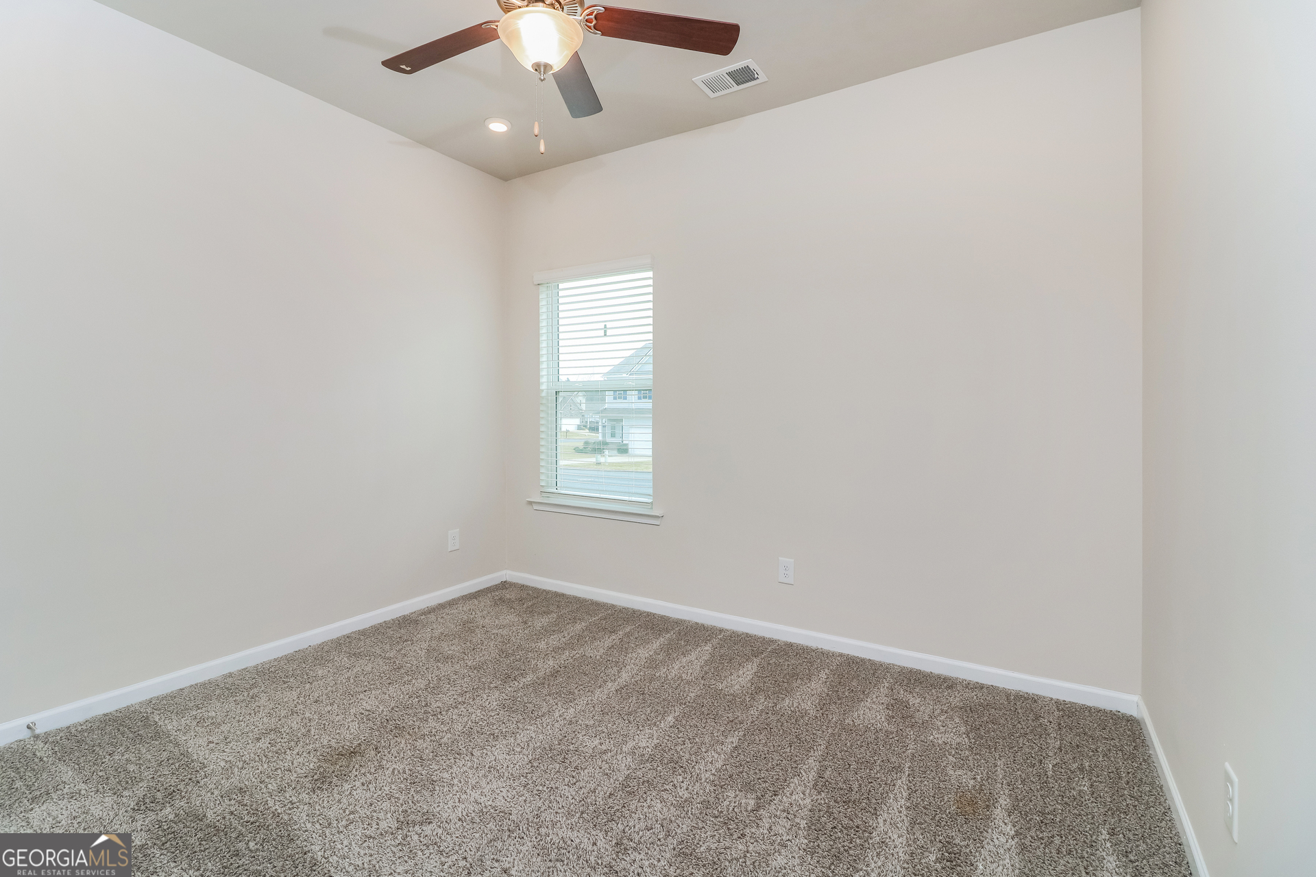 13 Applewood Drive Northeast Rome, GA 30165 - Photo 15 of 22 an empty room with a window and a fan