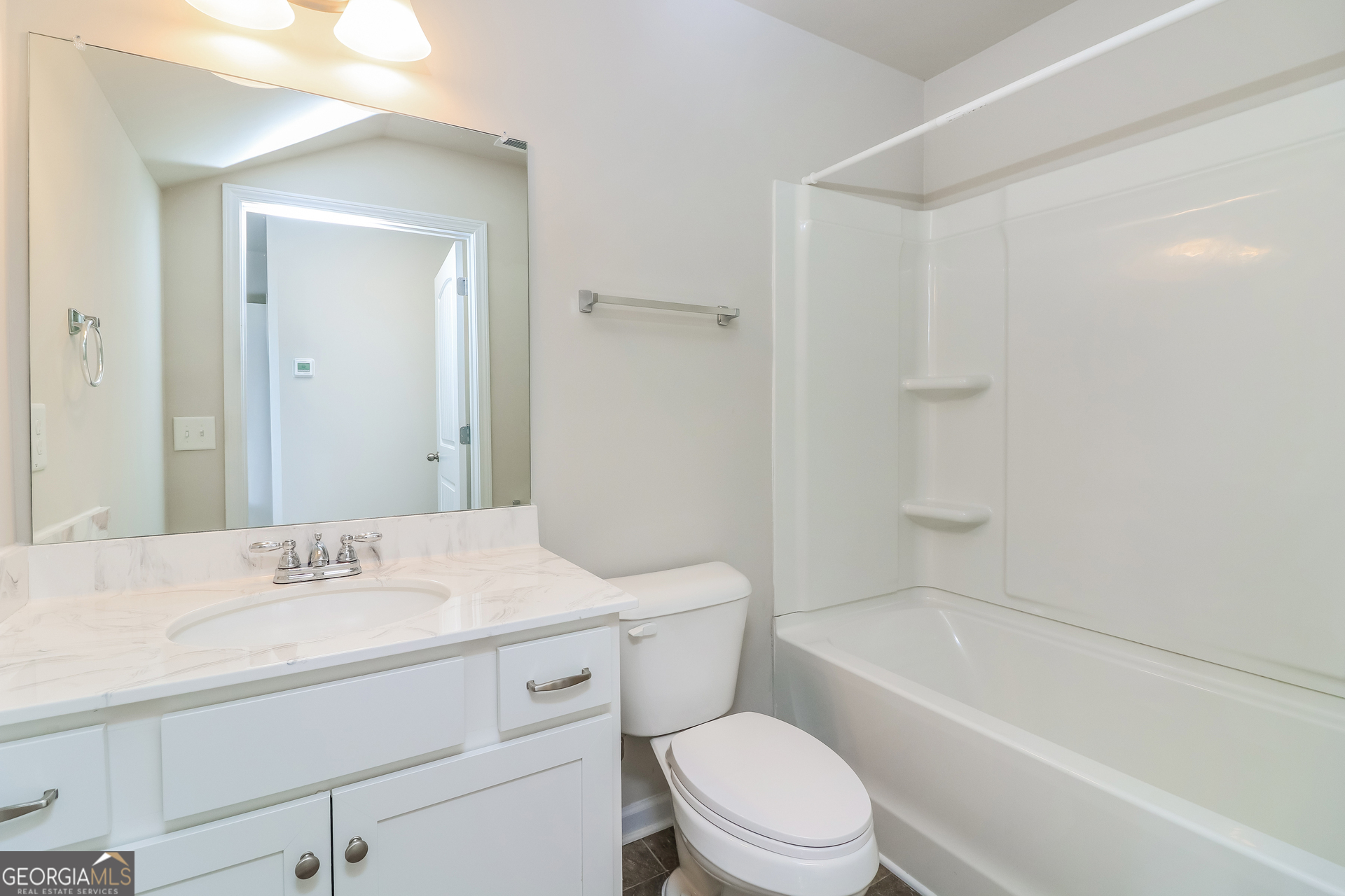 13 Applewood Drive Northeast Rome, GA 30165 - Photo 18 of 22 a bathroom with a sink toilet vanity and shower