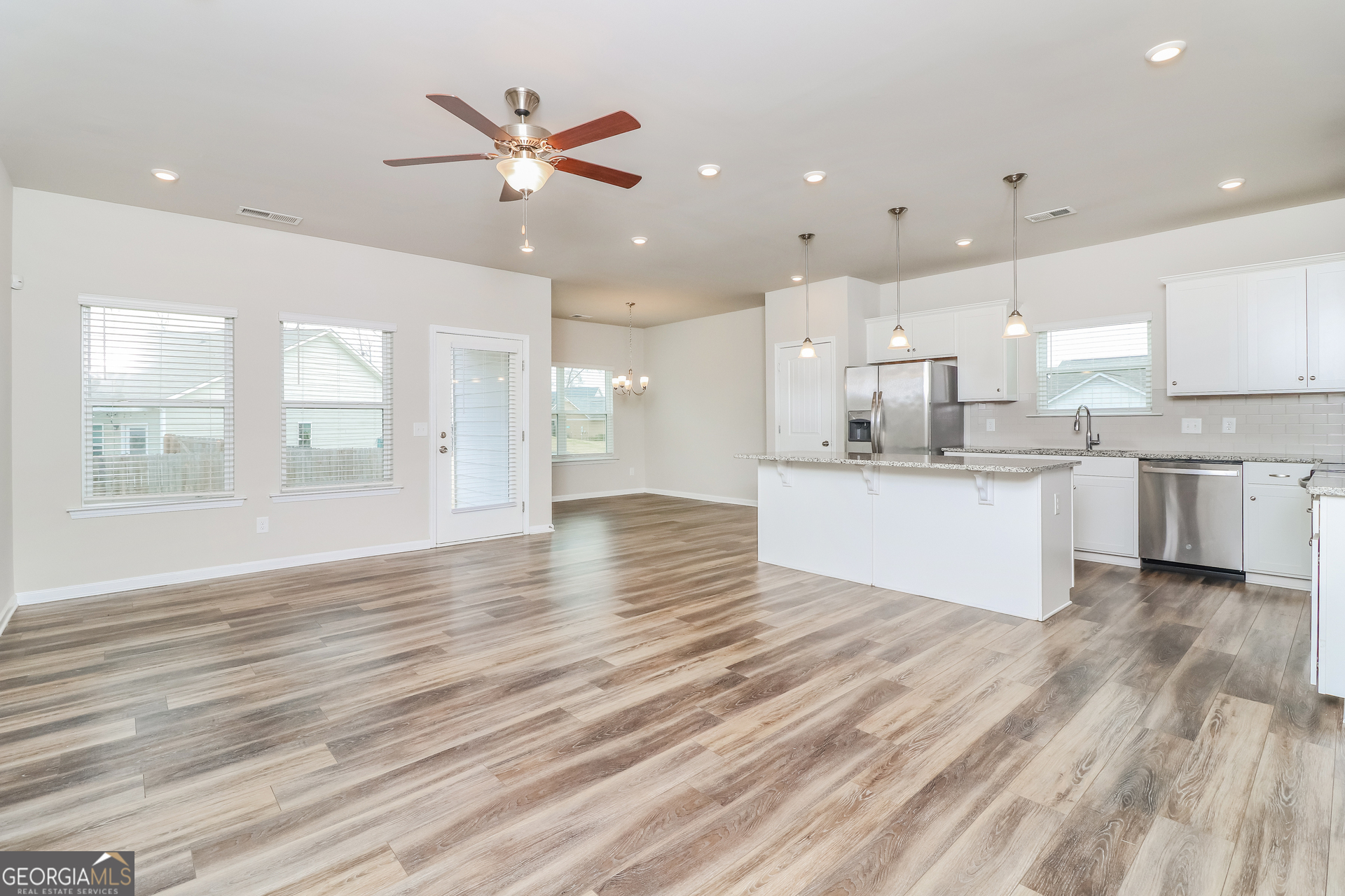 13 Applewood Drive Northeast Rome, GA 30165 - Photo 4 of 22 a view of a kitchen with kitchen island a sink stainless steel appliances and cabinets