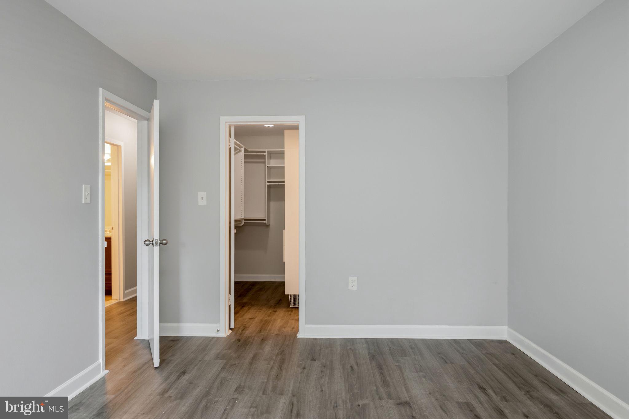 1443 Northgate Square, Unit 22B Reston, VA 20190 - Photo 19 of 42 a view of a hallway with wooden floor