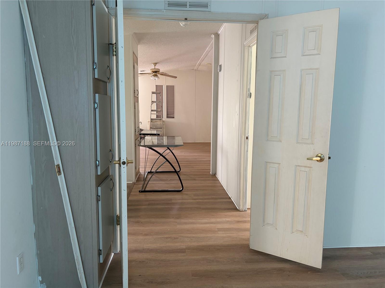 35303 Southwest 180th Avenue, Unit 391 Homestead, FL 33034 - Photo 13 of 23 a view of a livingroom from a hallway