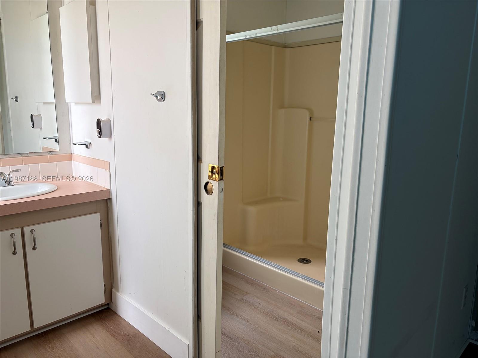 35303 Southwest 180th Avenue, Unit 391 Homestead, FL 33034 - Photo 14 of 23 a bathroom with a shower and a sink