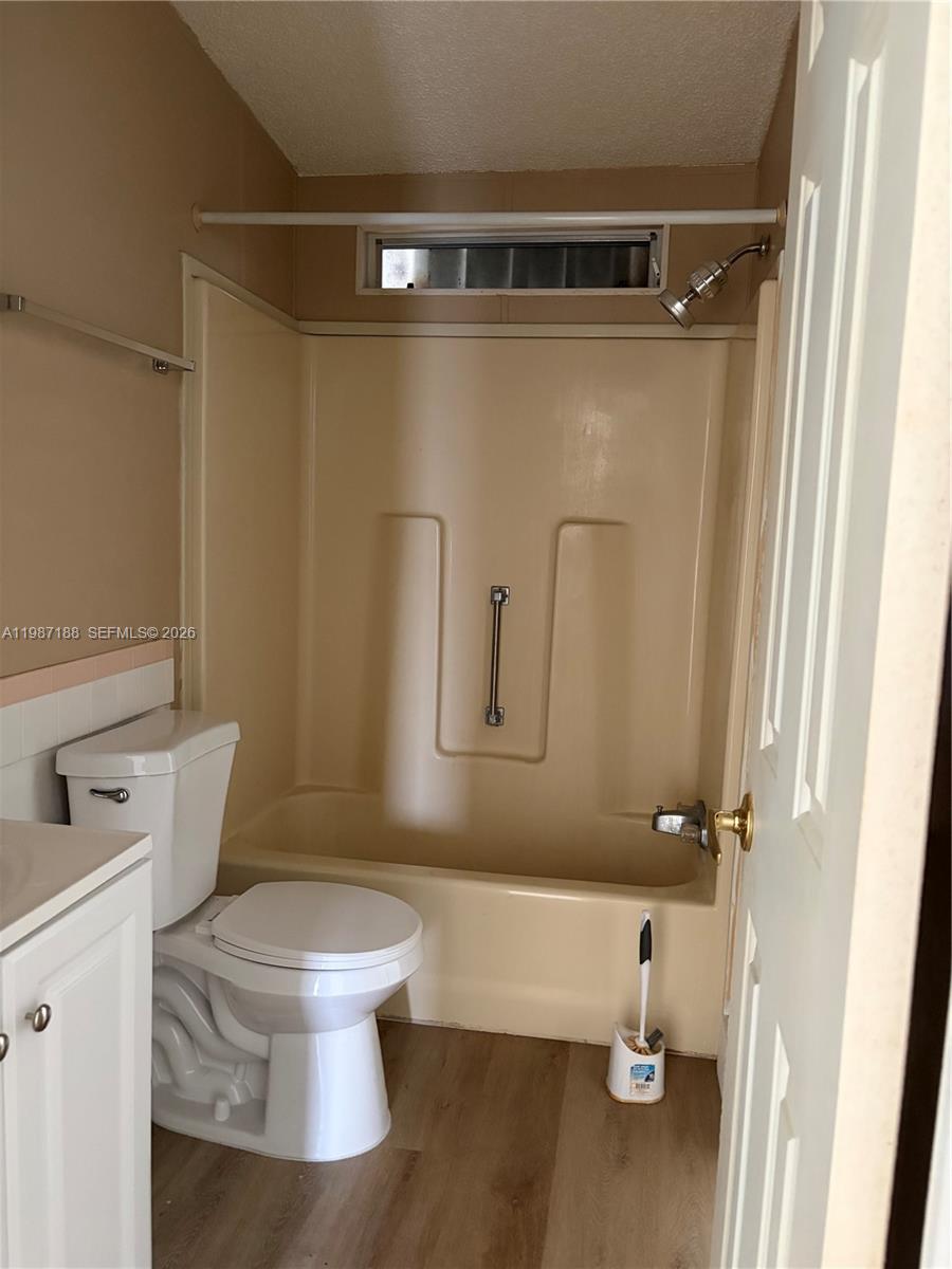 35303 Southwest 180th Avenue, Unit 391 Homestead, FL 33034 - Photo 18 of 23 a white toilet sitting next to a bathroom sink