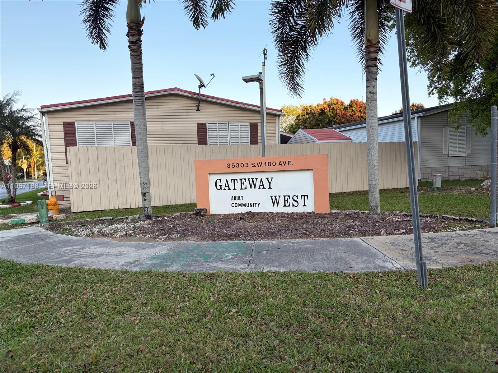 35303 Southwest 180th Avenue, Unit 391 Homestead, FL 33034 - Photo 8 of 23 a sign on the side of a building