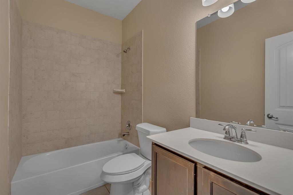 3812 Fordham Street Frisco, TX 75036 - Photo 26 of 33 Full bath with shower / bath combination, a textured wall, and vanity