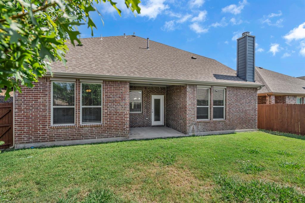 3812 Fordham Street Frisco, TX 75036 - Photo 31 of 33 Rear view of house featuring a fenced backyard, roof with shingles, a patio, a chimney, and brick siding