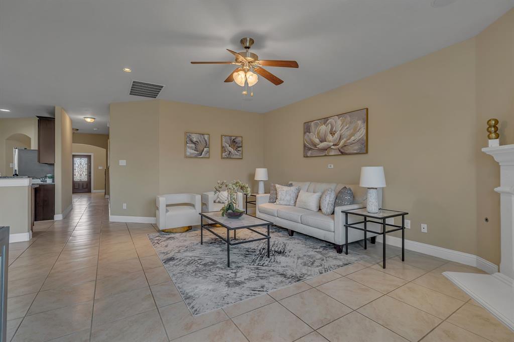 3812 Fordham Street Frisco, TX 75036 - Photo 8 of 33 Living area featuring arched walkways, recessed lighting, light tile patterned floors, and a ceiling fan