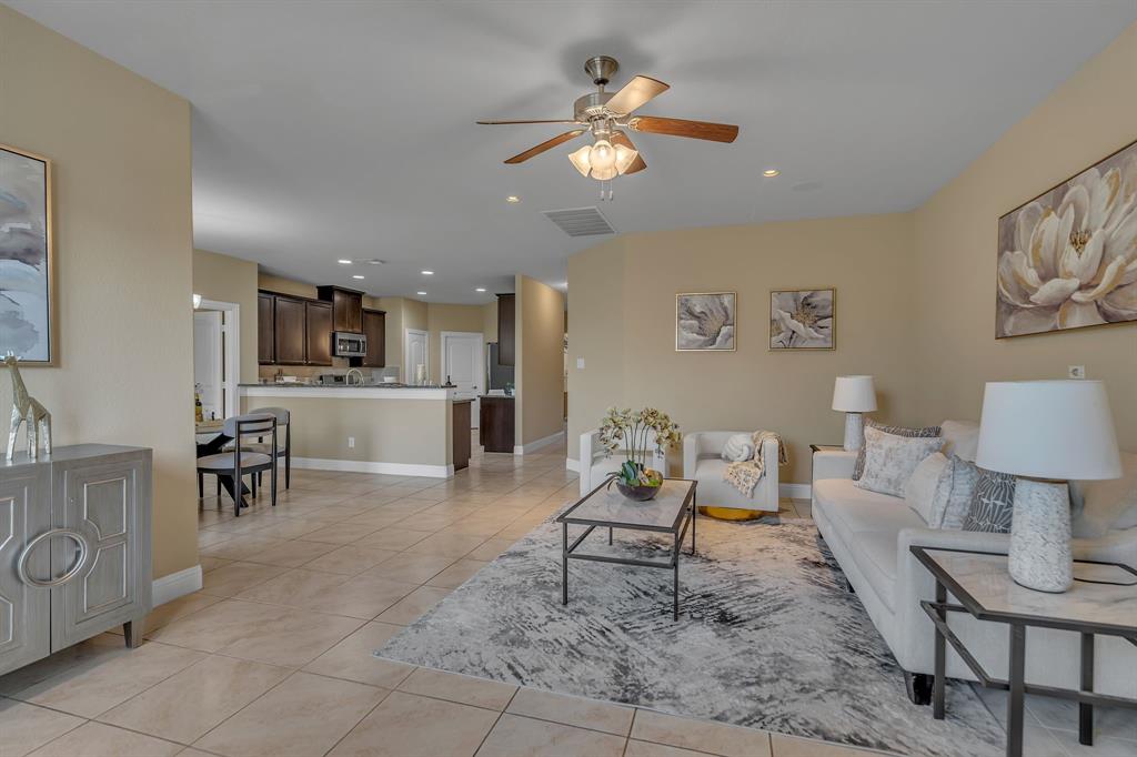 3812 Fordham Street Frisco, TX 75036 - Photo 9 of 33 Living area with recessed lighting, light tile patterned floors, and a ceiling fan