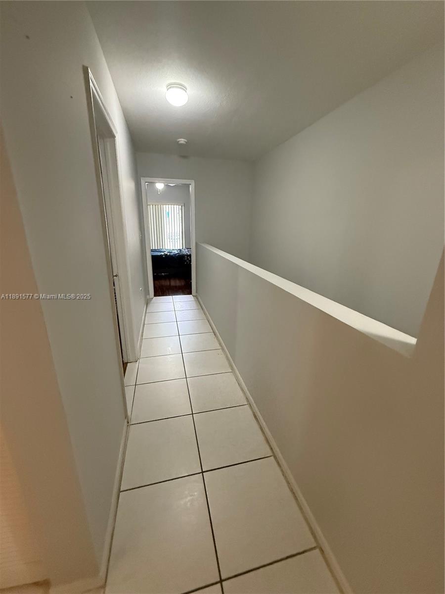 7145 Northwest 173rd Drive, Unit 1106 Hialeah, FL 33015 - Photo 17 of 17 a view of an empty room and a window