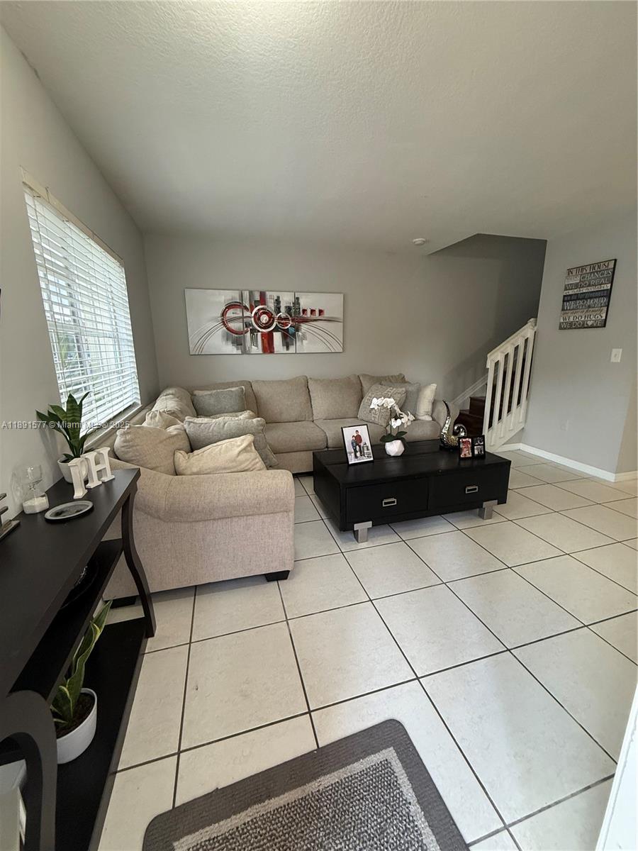 7145 Northwest 173rd Drive, Unit 1106 Hialeah, FL 33015 - Photo 10 of 17 a living room with furniture
