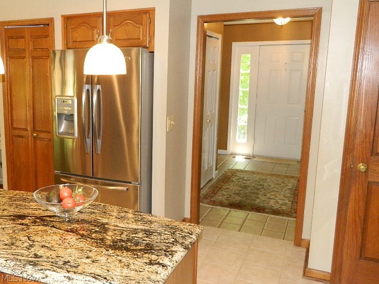 7580 Maple Grove Road Chesterland, OH 44026 - Photo 5 of 35 Ceramic Foyer Entrance with Guest Closet Into the Expansive Kitchen!