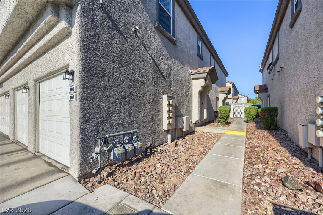 5985 High Steed Street, Unit 101 Henderson, NV 89011 - Photo 33 of 38 Attached garages provide convenience and direct access to this inviting multi-family residence.