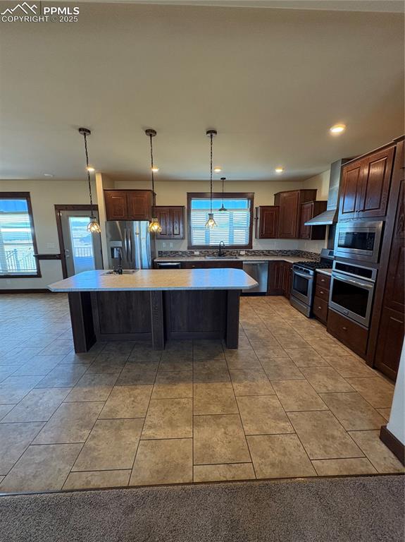 1925 Doe Valley Road Guffey, CO 80820 - Photo 18 of 30 a room with stainless steel appliances kitchen island granite countertop a sink and cabinets