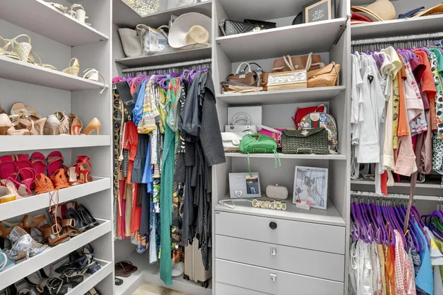 a dining room with furniture and a potted plant