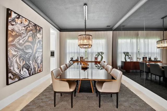 a living room with furniture flat screen tv and a large window
