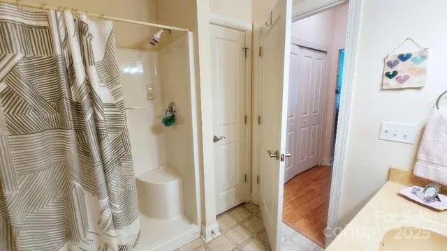 a bathroom with a bathtub and shower