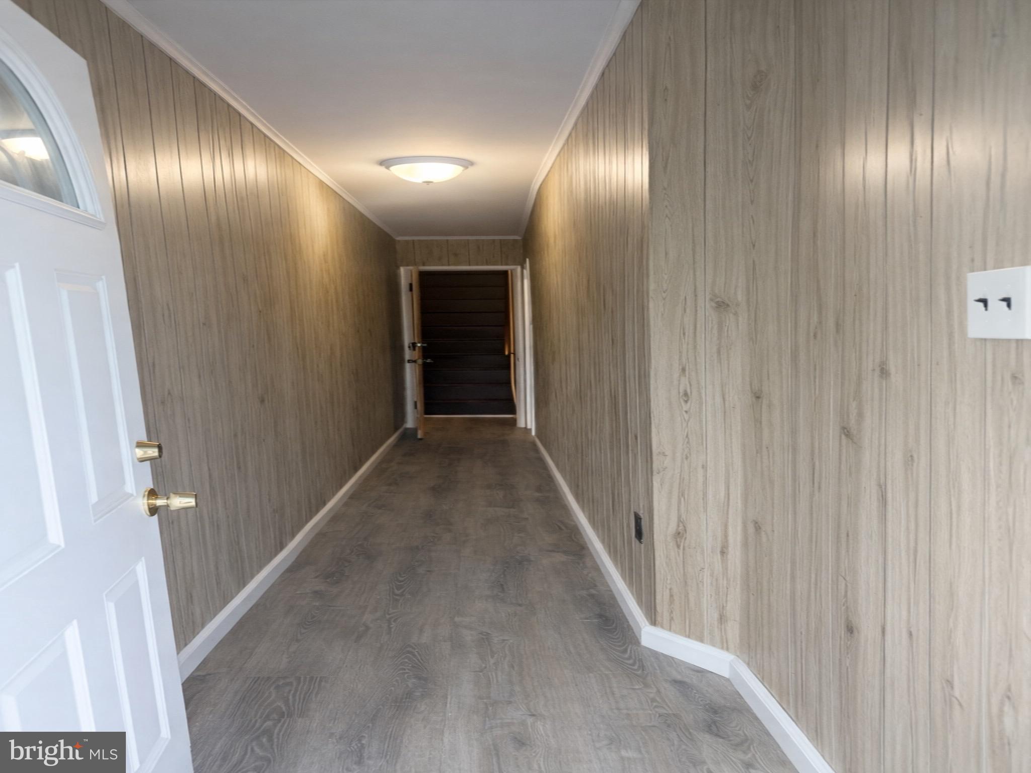 4564 Bermuda Street Philadelphia, PA 19124 - Photo 3 of 8 a view of a hallway with wooden floor