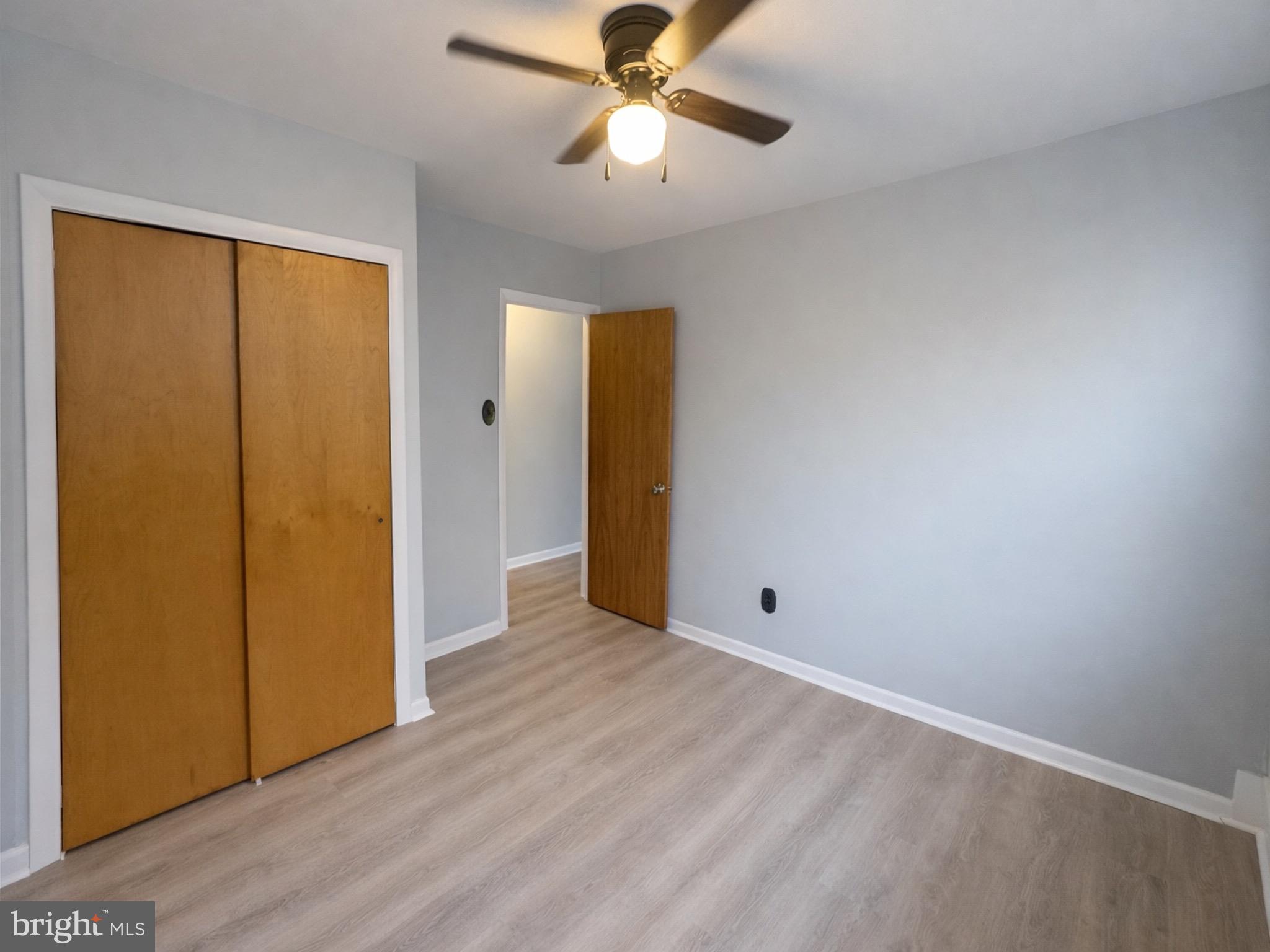 4564 Bermuda Street Philadelphia, PA 19124 - Photo 8 of 8 an empty room with closet and a chandelier fan