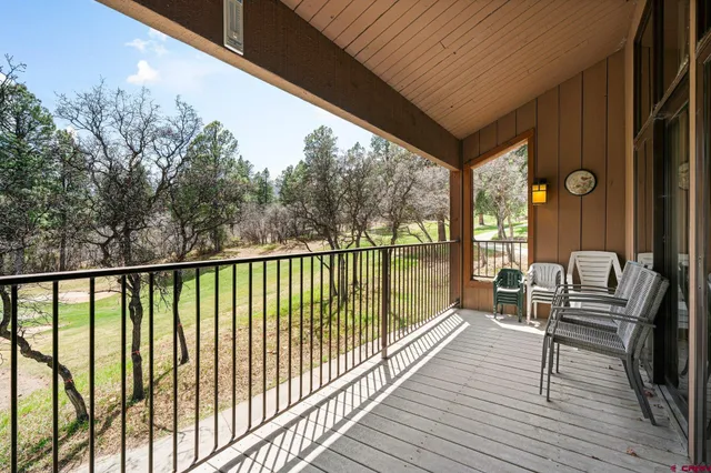 a view of balcony with wooden floor