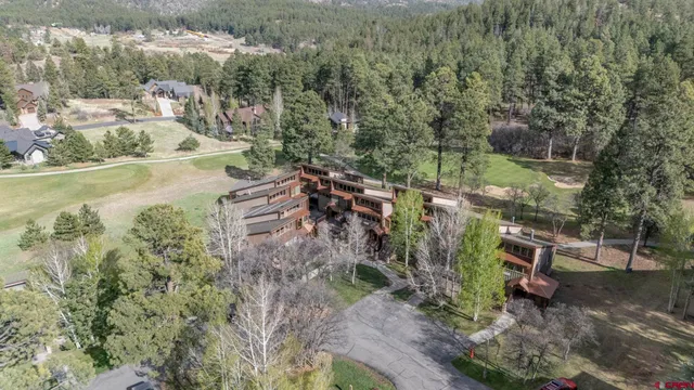 a view of a town with mountains in the background