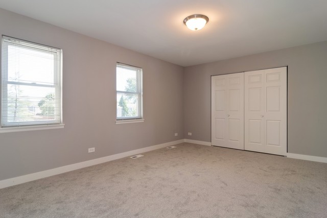204 Rodenburg Road Roselle, IL 60172 - Photo 9 of 12 an empty room with windows