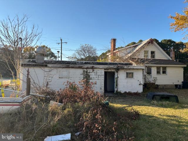 22314 Pot Pie Road Wittman, MD 21676 - Photo 11 of 14 a front view of a house with a yard