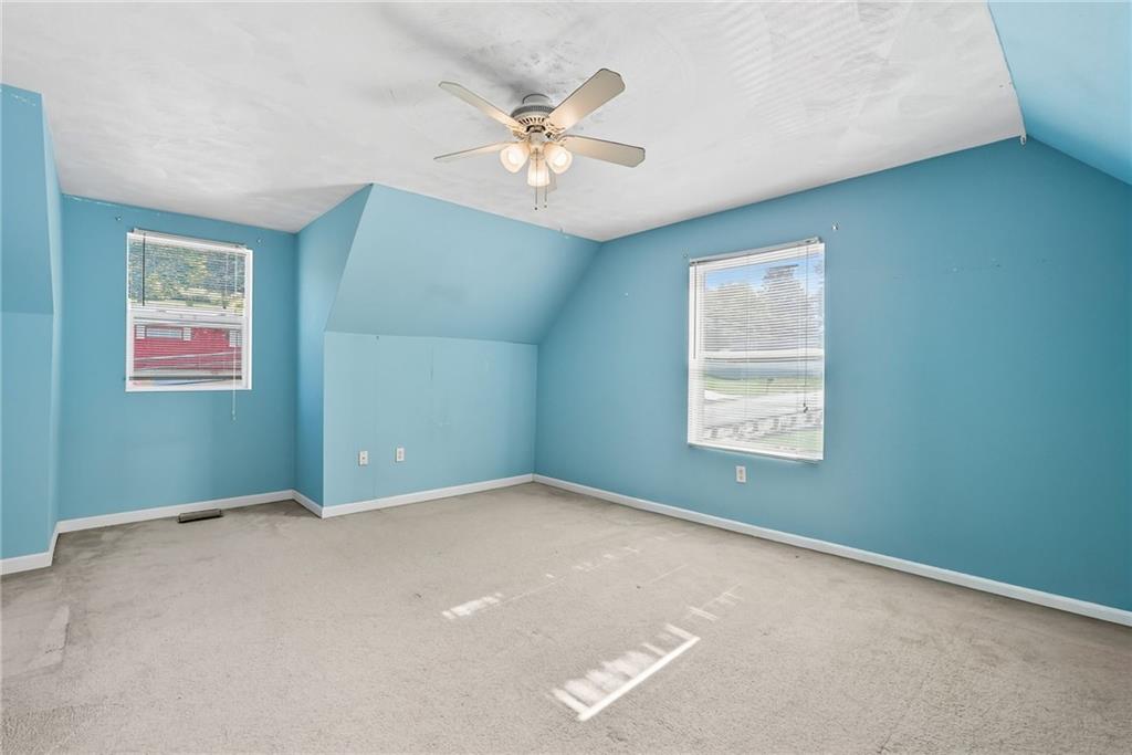 2430 Coulterville Road Irwin, PA 15642 - Photo 12 of 34 an empty room with windows and fan