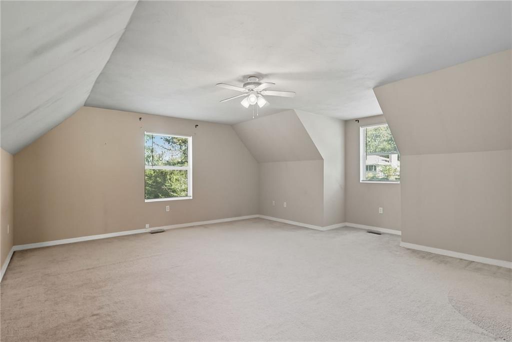 2430 Coulterville Road Irwin, PA 15642 - Photo 13 of 34 an empty room with a window and a fan