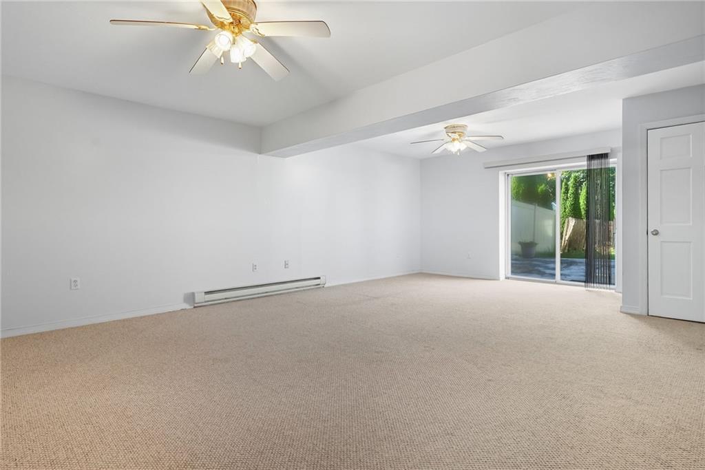 2430 Coulterville Road Irwin, PA 15642 - Photo 17 of 34 an empty room with chandelier fan and windows