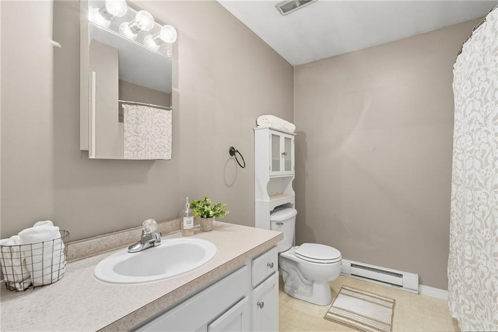 2430 Coulterville Road Irwin, PA 15642 - Photo 21 of 34 a bathroom with a sink toilet and mirror