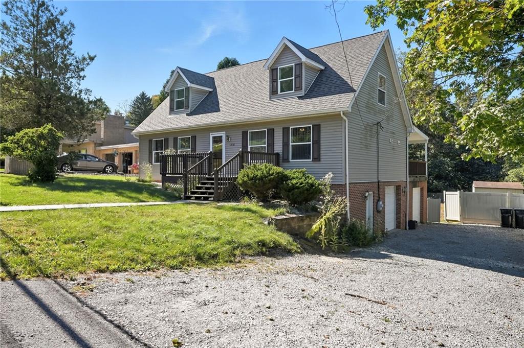 2430 Coulterville Road Irwin, PA 15642 - Photo 5 of 34 a front view of a house with garden