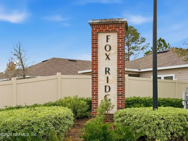 a couple of potted plants in front of door