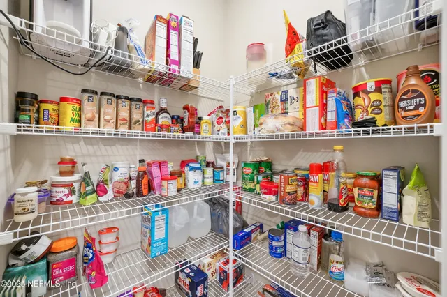 a store room with lots of clutter and flowers