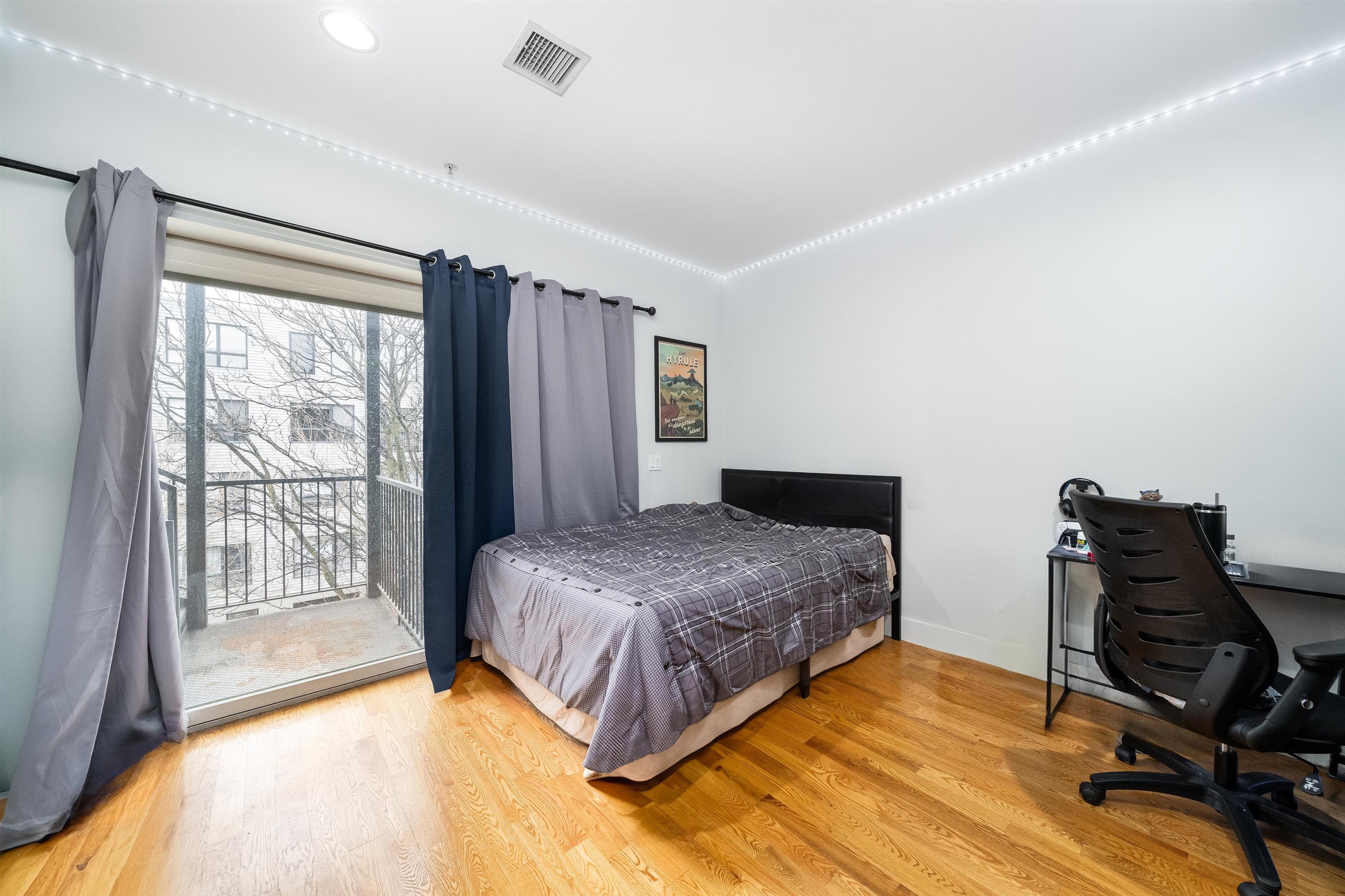 516 Monroe Street, Unit 3 Hoboken, NJ 07030 - Photo 13 of 13 a bedroom with a bed and a window