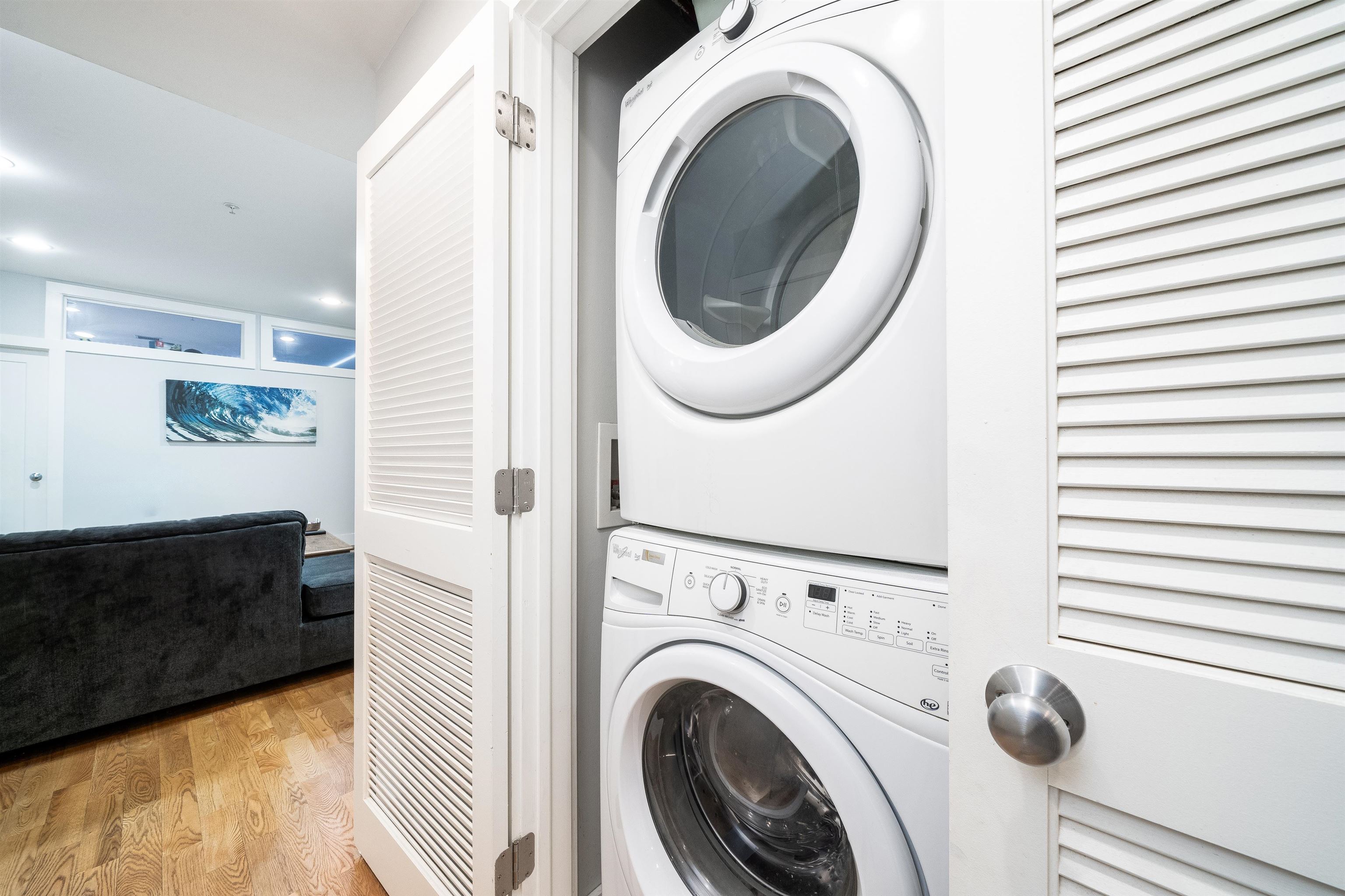 516 Monroe Street, Unit 3 Hoboken, NJ 07030 - Photo 6 of 13 a view of a hallway with washer and dryer