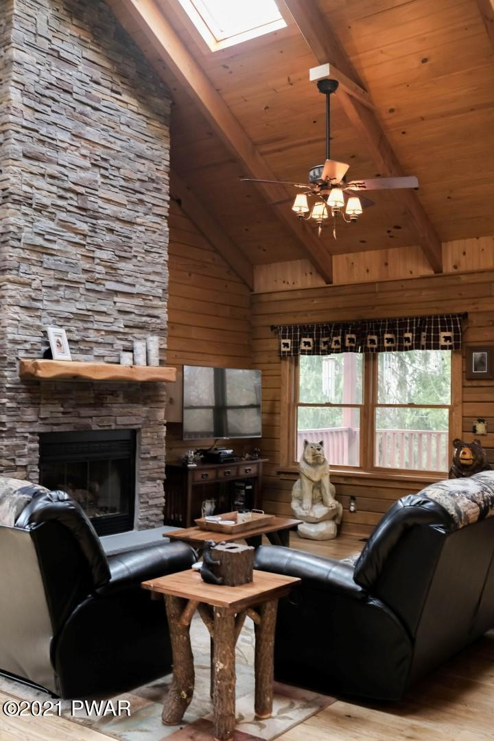 118 Cindy Court Newfoundland, PA 18445 - Photo 22 of 78 a living room with furniture a fireplace and a chandelier
