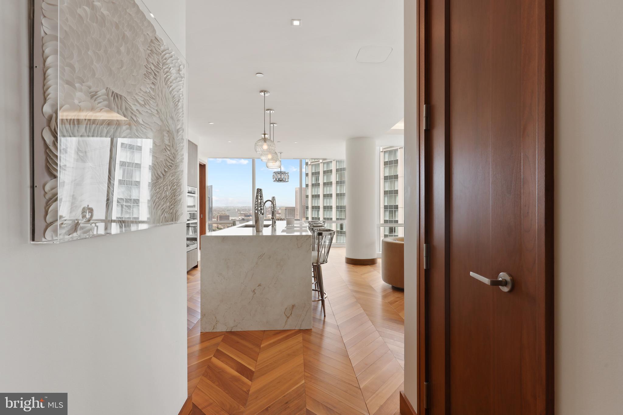 300 International Drive, Unit 2403 Baltimore, MD 21202 - Photo 16 of 36 a view of kitchen and dining room