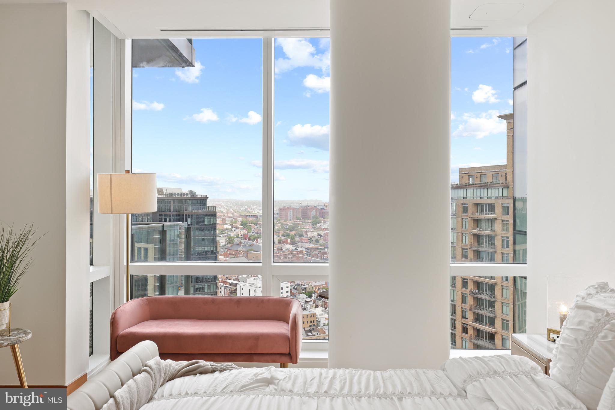 300 International Drive, Unit 2403 Baltimore, MD 21202 - Photo 30 of 36 a bedroom with furniture and a window