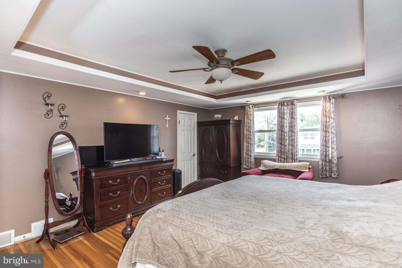 1216 Jennifer Road Philadelphia, PA 19116 - Photo 32 of 77 a bedroom with a bed and a flat screen tv