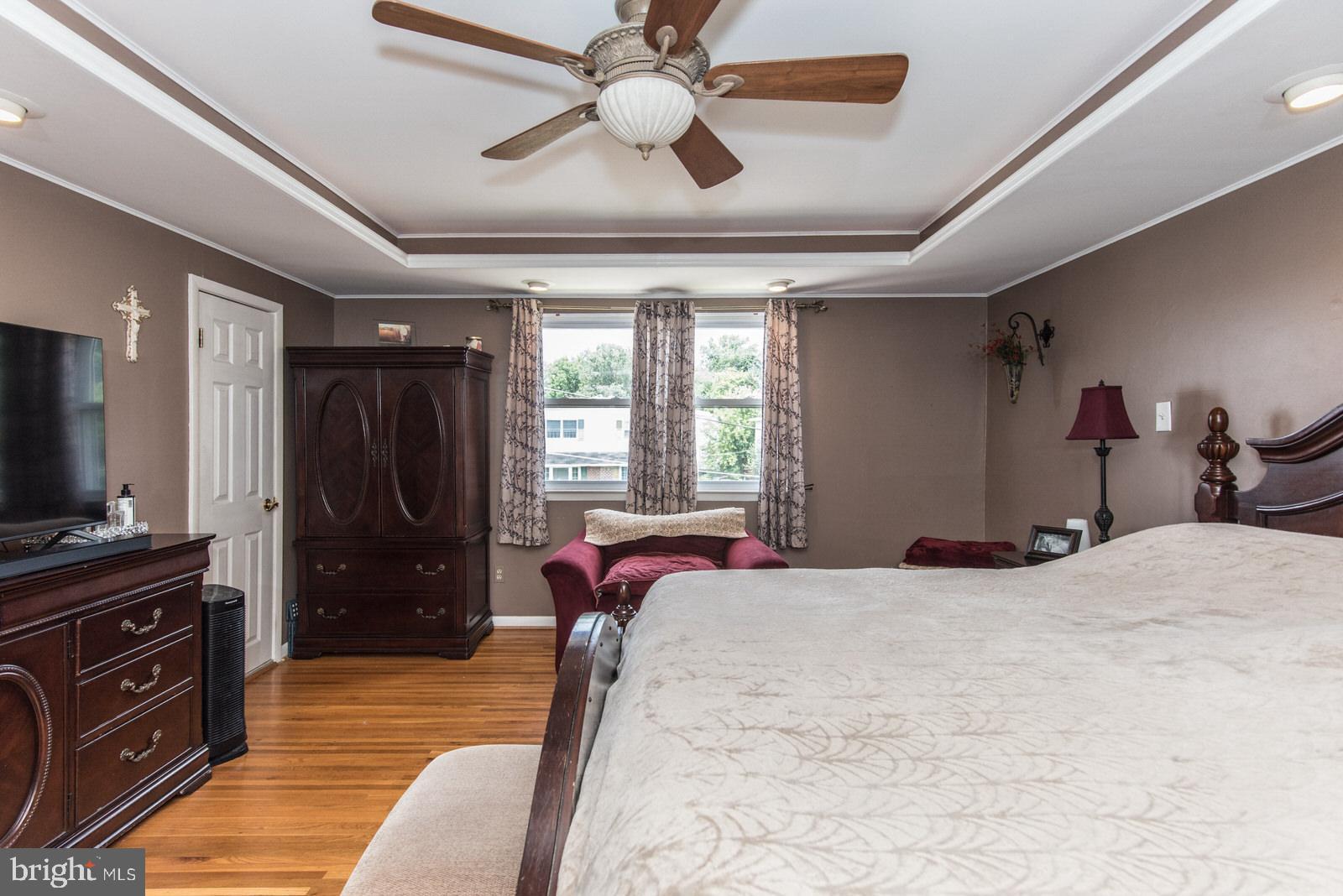 1216 Jennifer Road Philadelphia, PA 19116 - Photo 33 of 77 a bedroom with a bed and a flat tv screen on dresser
