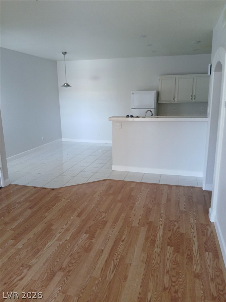 2201 Ramsgate Drive, Unit 426 Henderson, NV 89074 - Photo 18 of 22 This living space transitions seamlessly with a well-appointed kitchen.