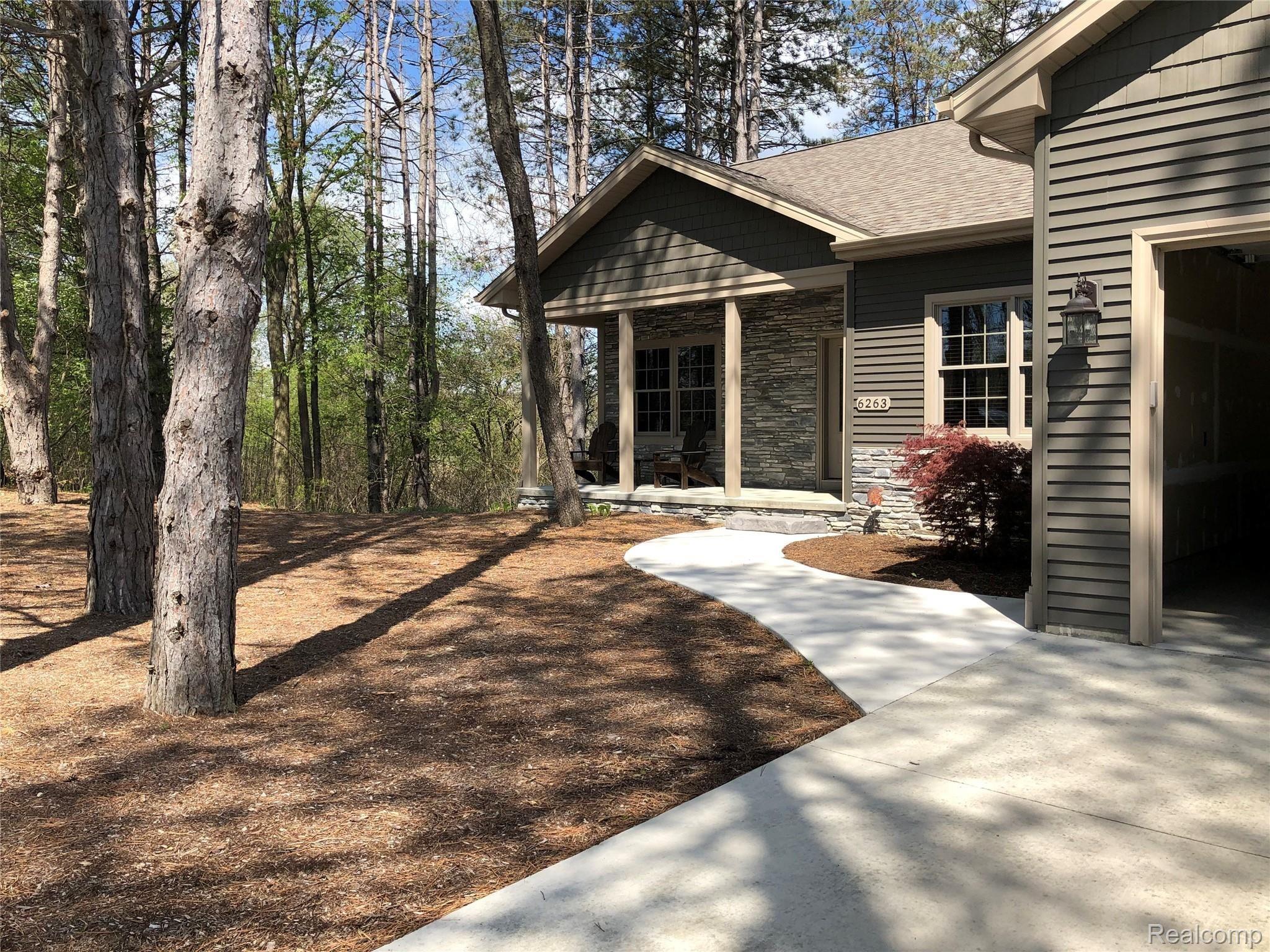 6263 General Squier Road Almont, MI 48003 - Photo 2 of 45 Concrete sidewalk approach to front entrance